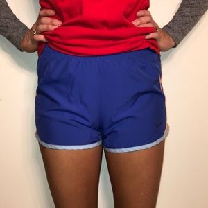 Nike athletic purple and orange running shorts